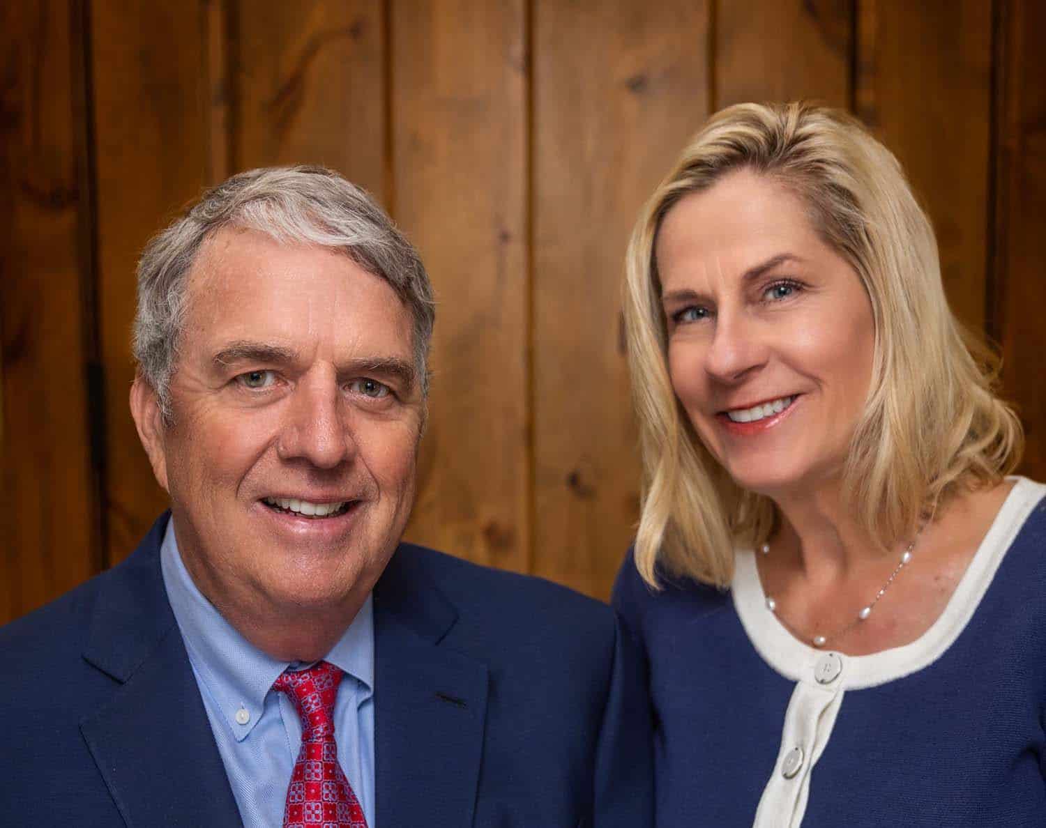Mr. and Mrs. Dana posing for a photo in a professional office setting.