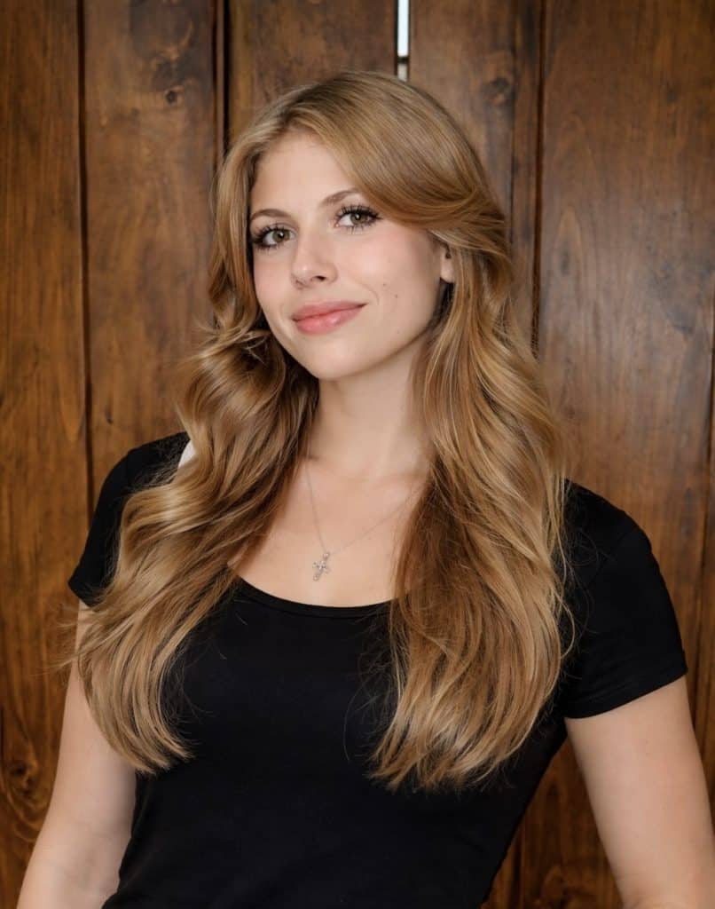 Dana Whiting Law office portrait with a professional woman in a black top.