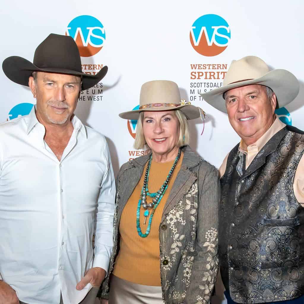 Western Spirit Scottsdale's Museum of the West event featuring Kevin Costner, Matt Dana, and his wife in cowboy hats and attire.