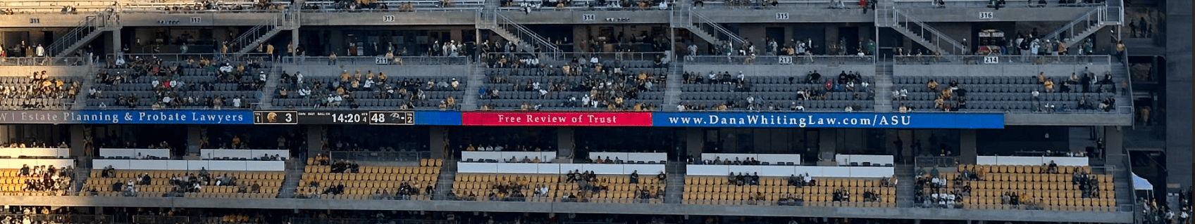 ASU Stadium with several fans in the audience, showing Dana Whiting Law LED banner circling the stadium.