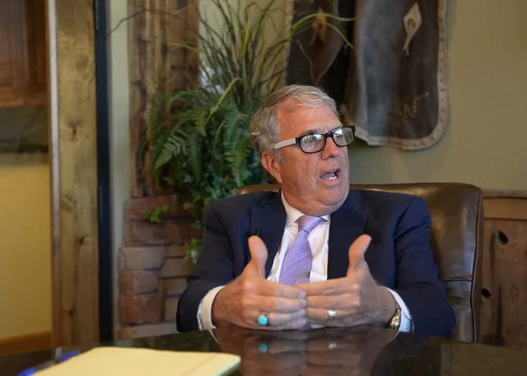 Lawyer Matt Dana discussing legal strategies in an office setting.