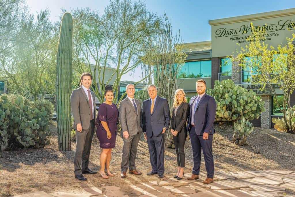 A group of six legal professionals standing outside Dana Whiting Law office in Arizona.