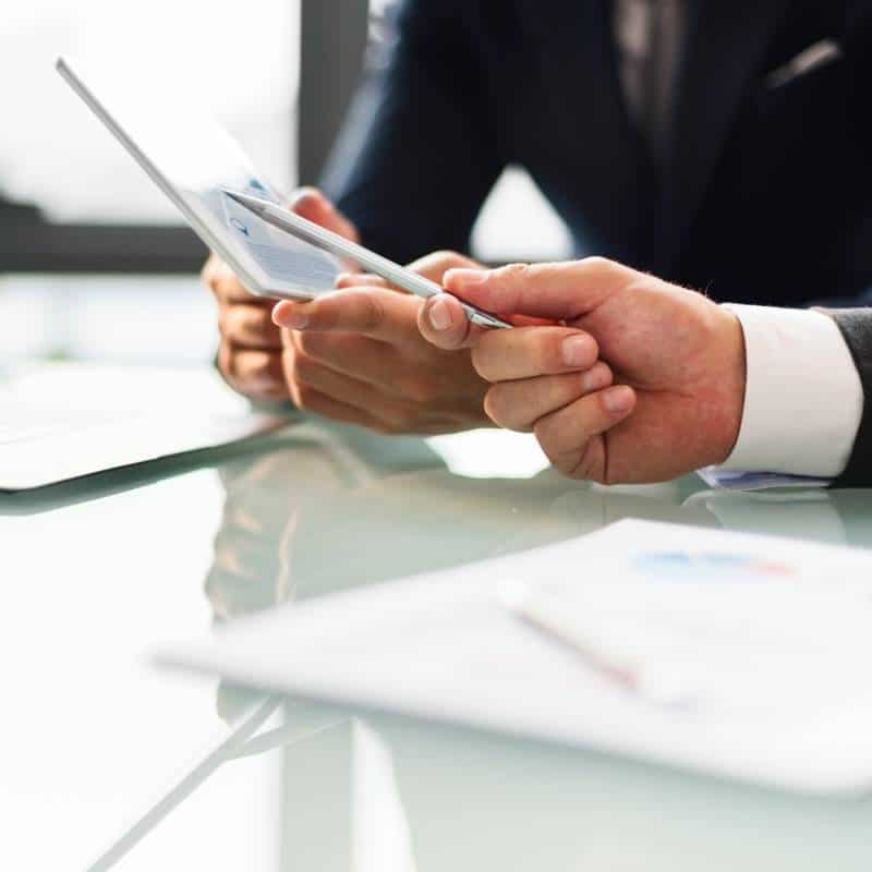 Business professional using a tablet for legal consultation.