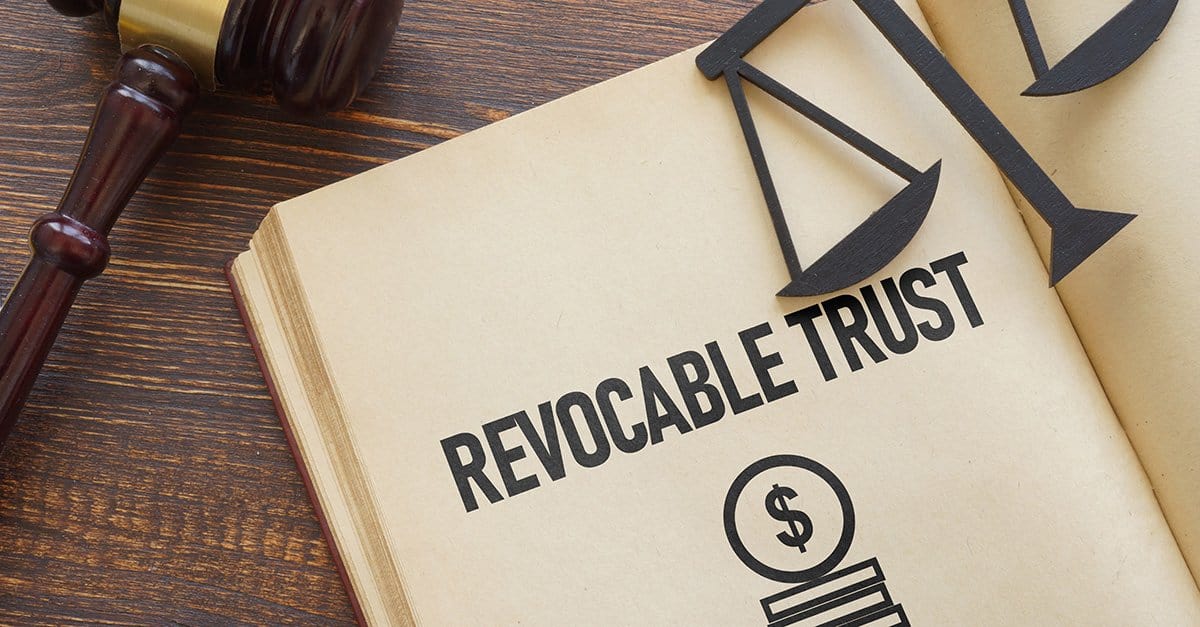Legal revocable trust document with gavel and scales of justice.