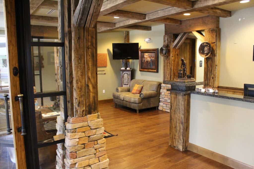 Interior view of Dana Whiting Law office with rustic wooden beams and cozy seating area.