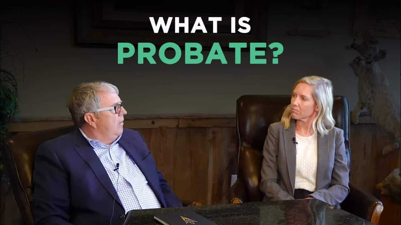 Estate planning attorney discussing probate process with a client in an office setting.